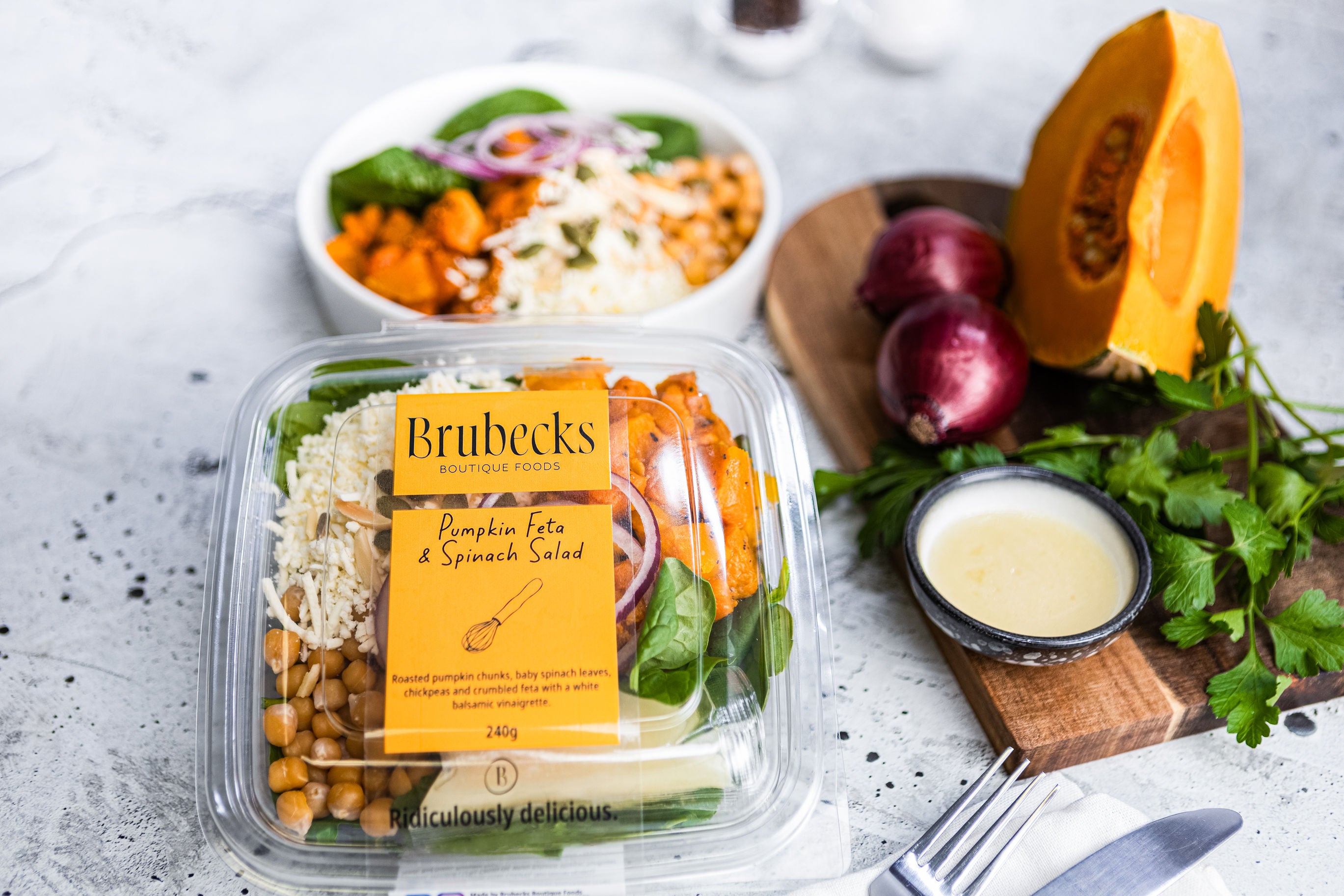 Brubecks salad packaging with ingredients on a table