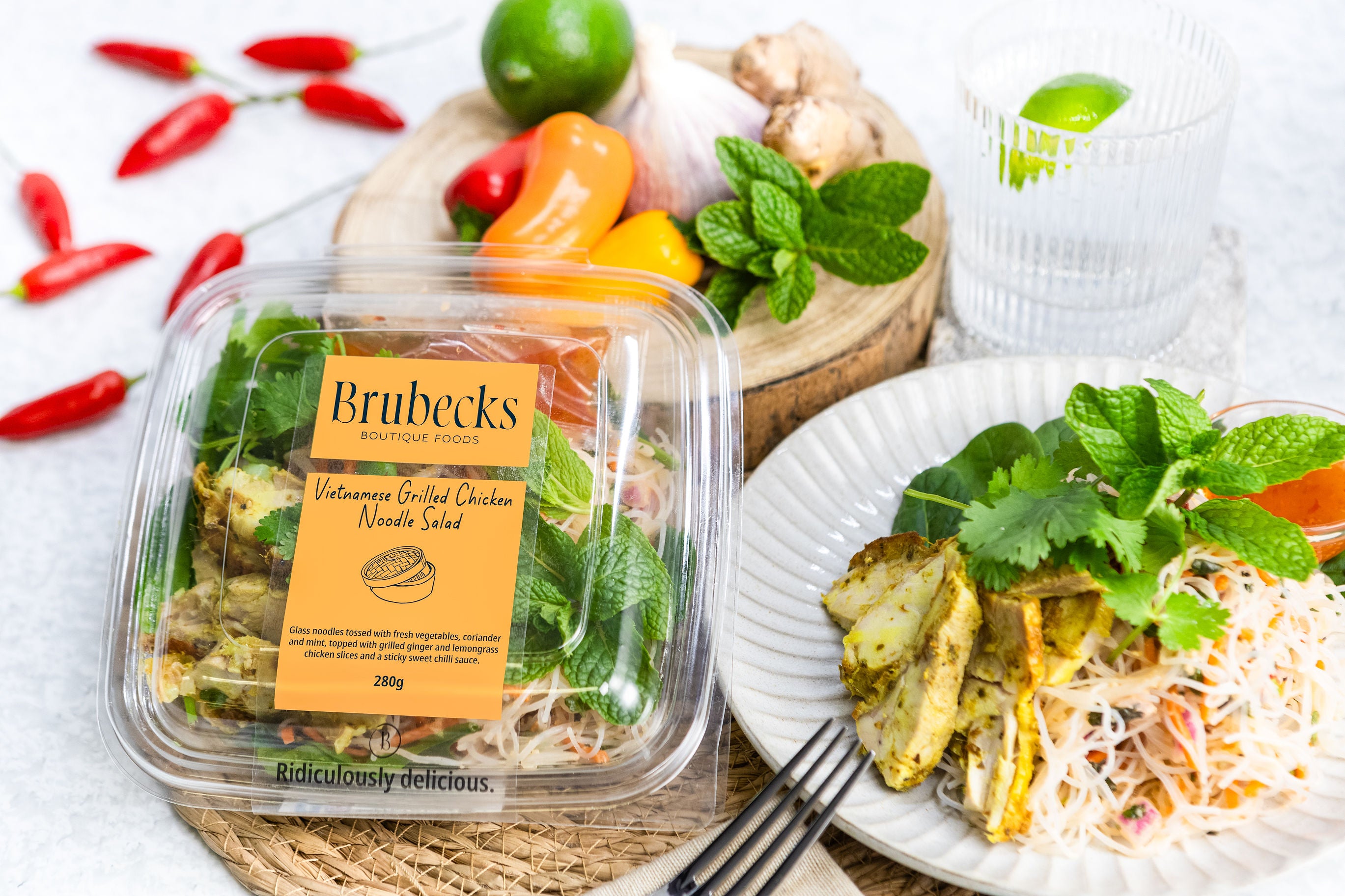 Brubecks Vietnamese Grilled Chicken Noodle Salad packaging with a sample salad on a plate.