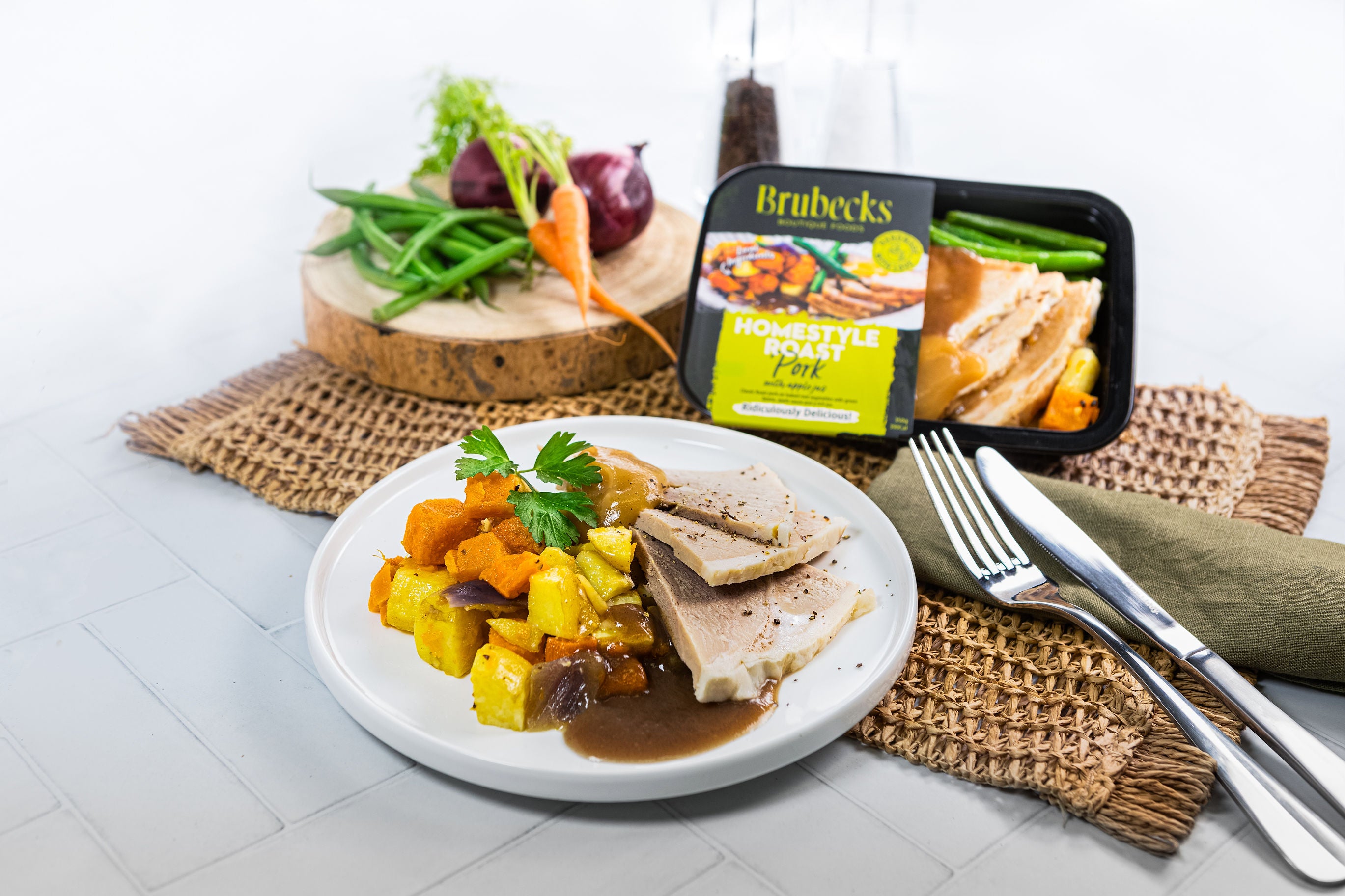 Plated meal with Brubecks packaging on a white surface