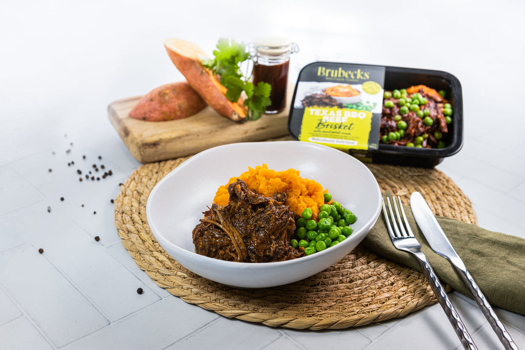 Bowl of food with sides on a white surface, featuring Brubecks package.