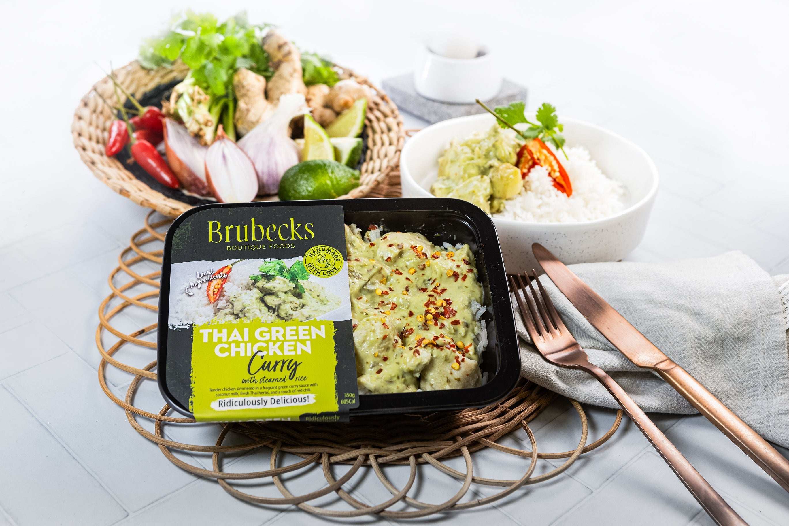 Brubecks Thai Green Curry package on a table with a fork and knife