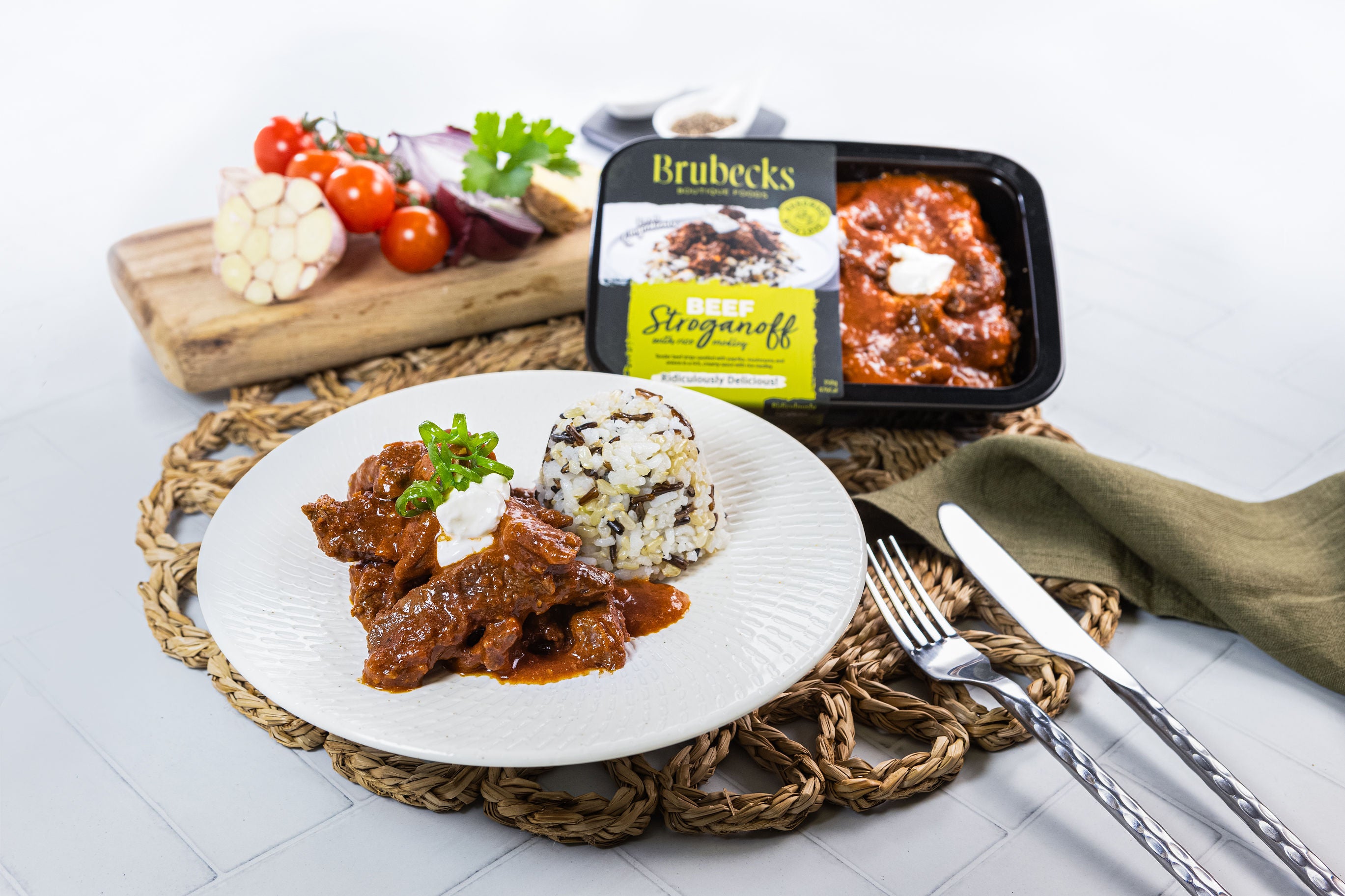 Brubeck's Stroganoff with a package of the product on a white plate with a fork and knife.