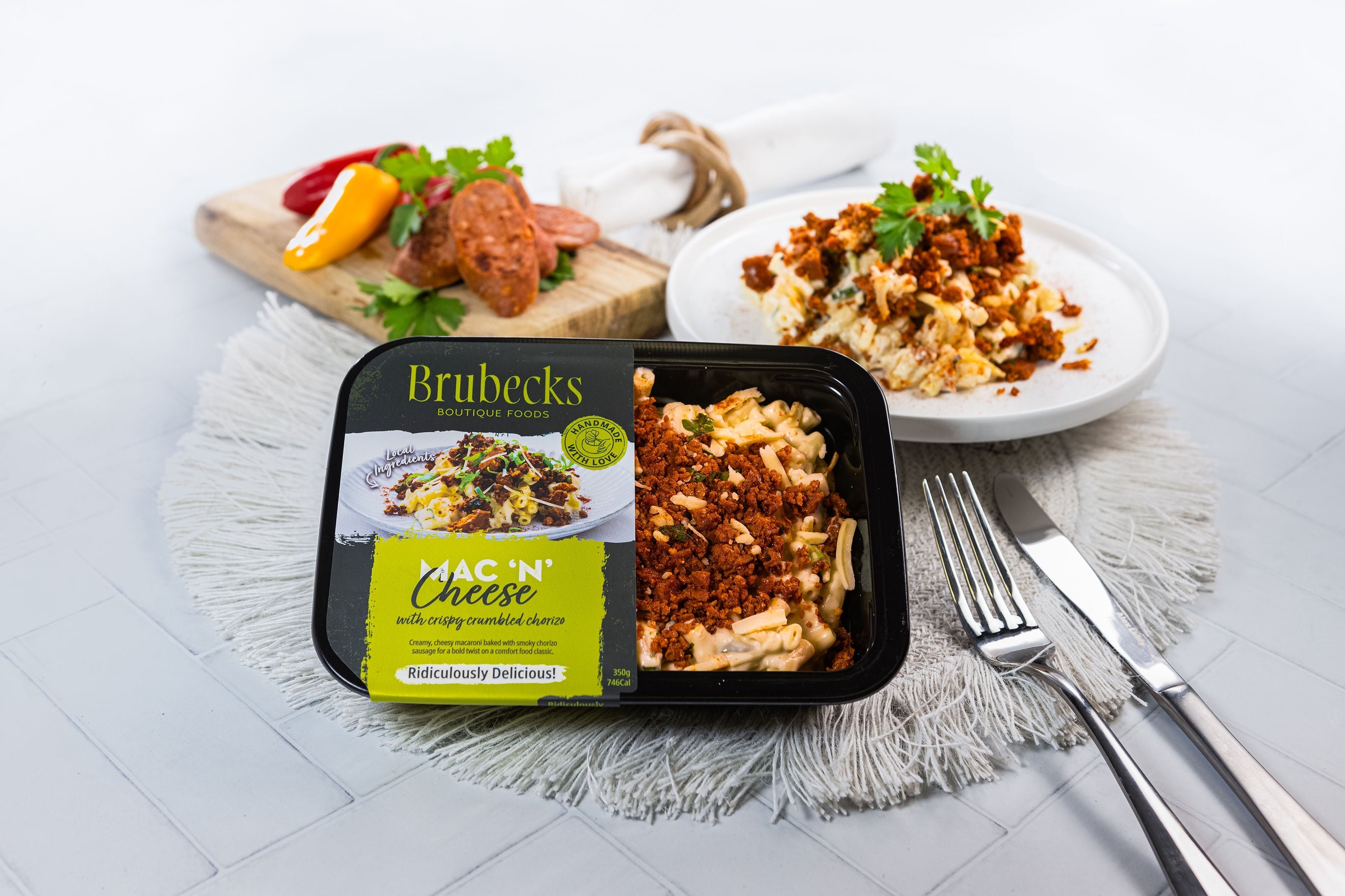 Brubecks macaroni and cheese packaging with a plate of food in the background