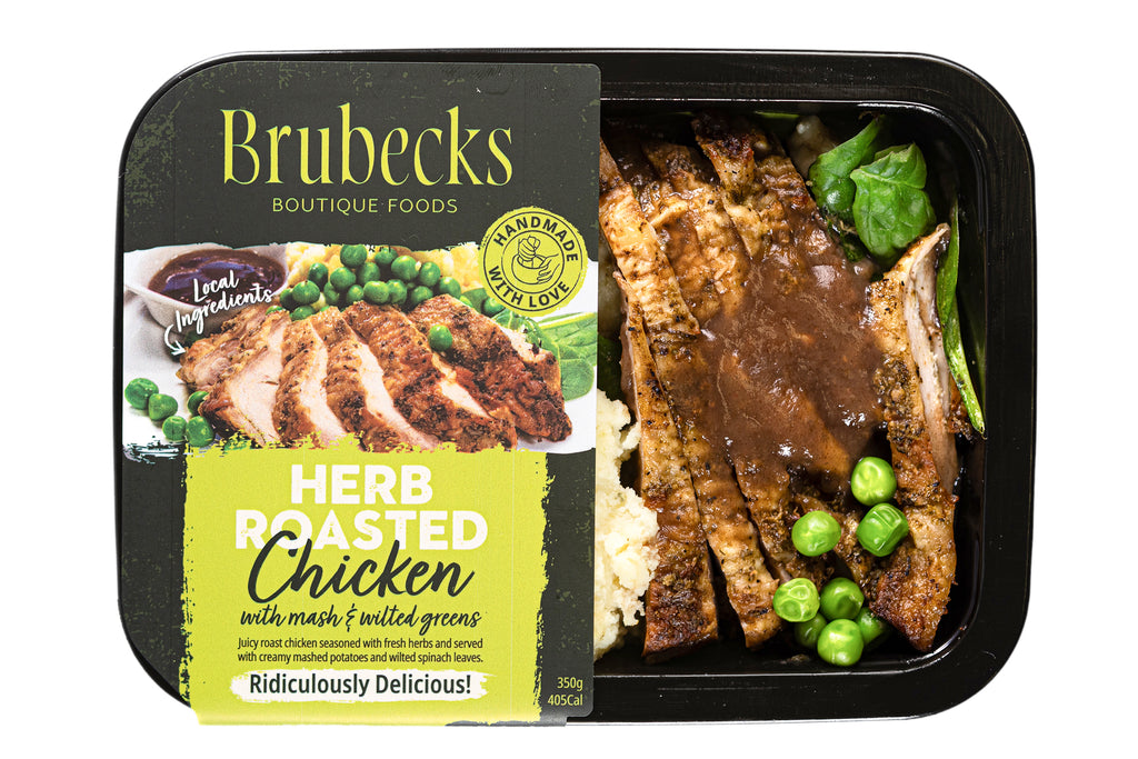 Brubecks herb roasted chicken meal in a black packaging tray with visible chicken, peas, and greens.