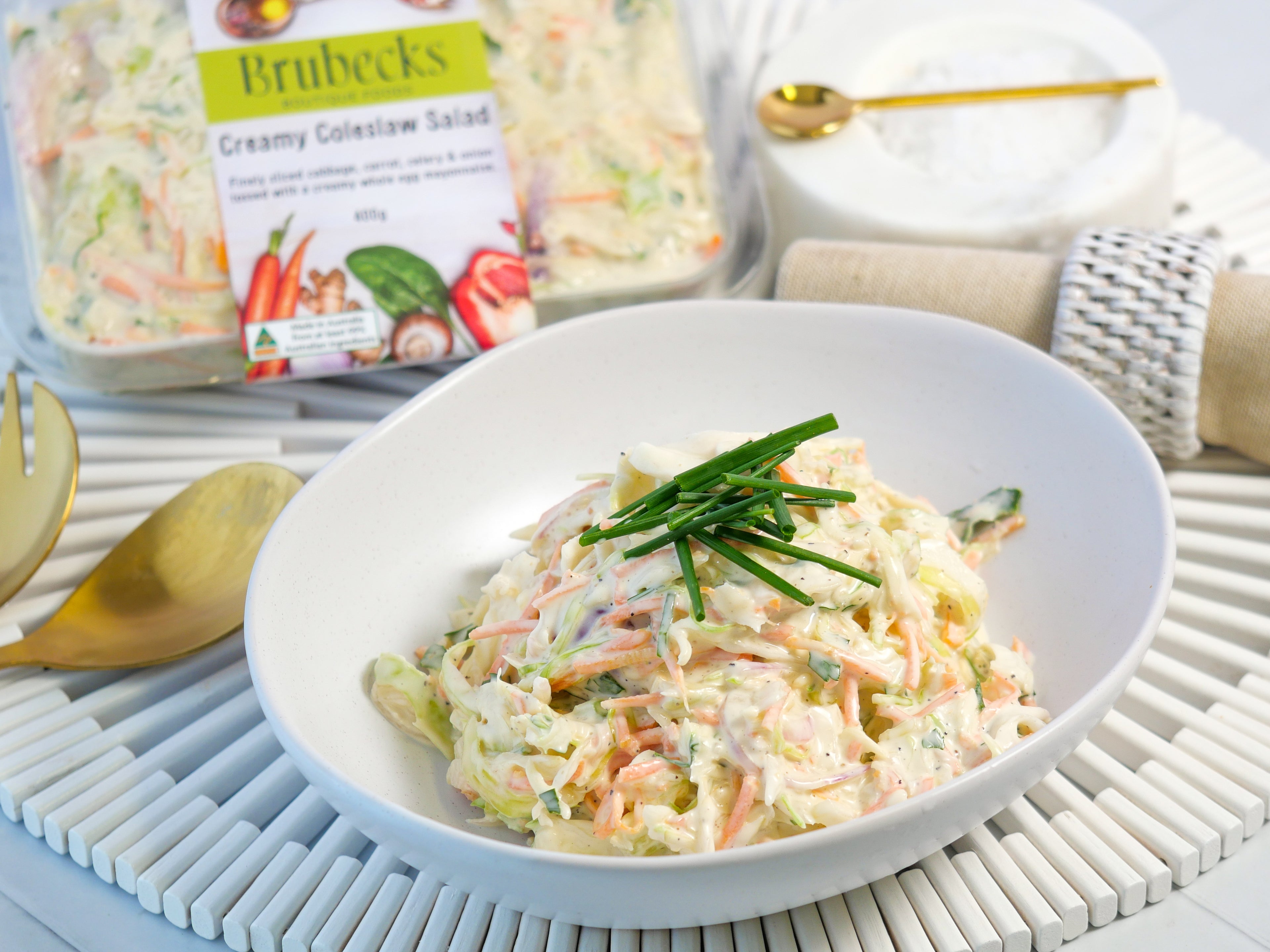 Brubeck's creamy cole slaw salad in a bowl with packaging in the background.