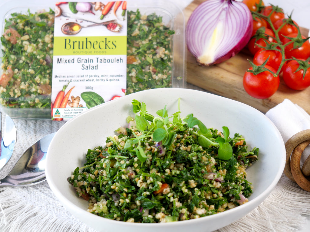 Bowl of mixed grain tabbouleh salad with Brubecks packaging in the background