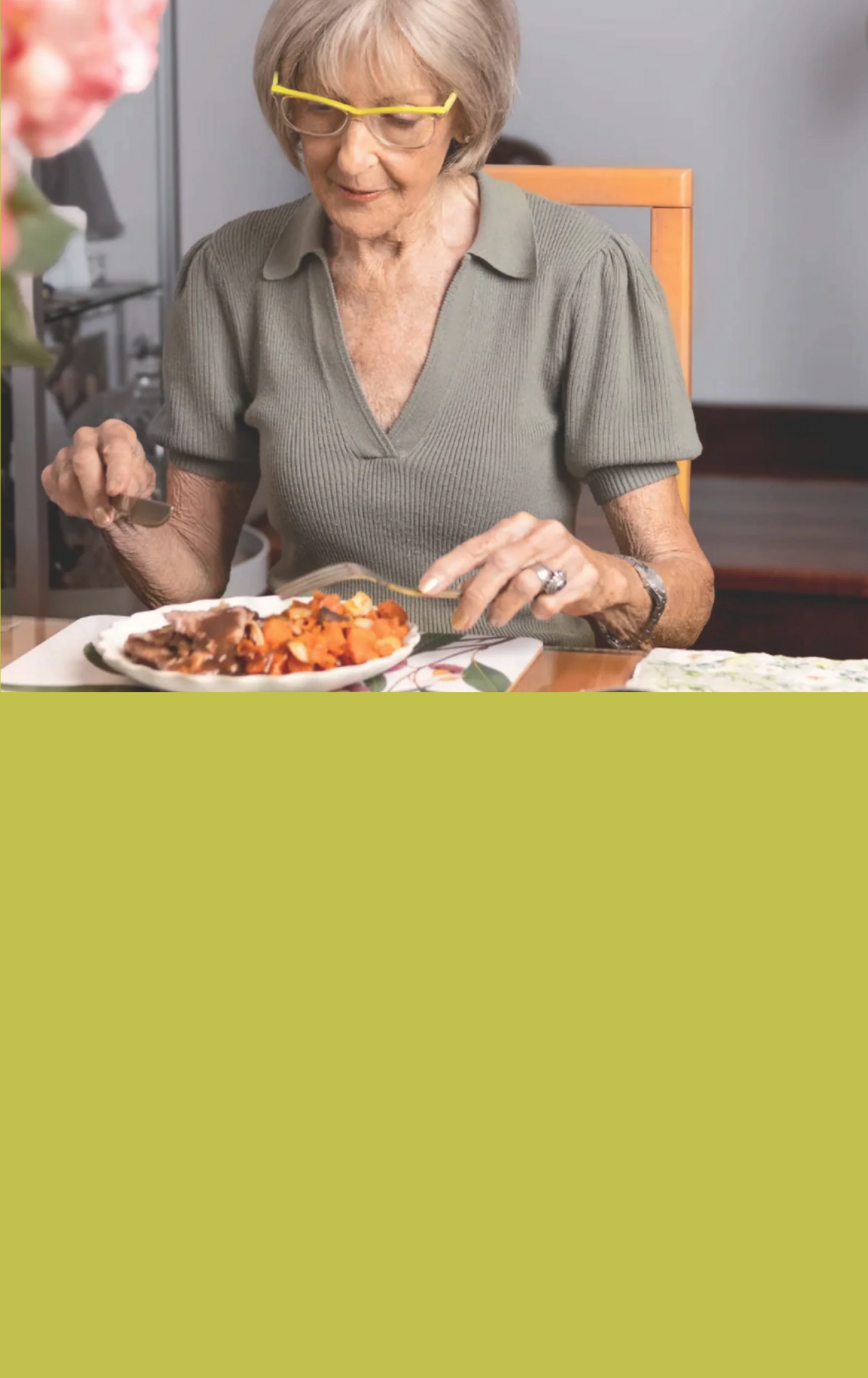 Woman eating a meal at a table with a green overlay