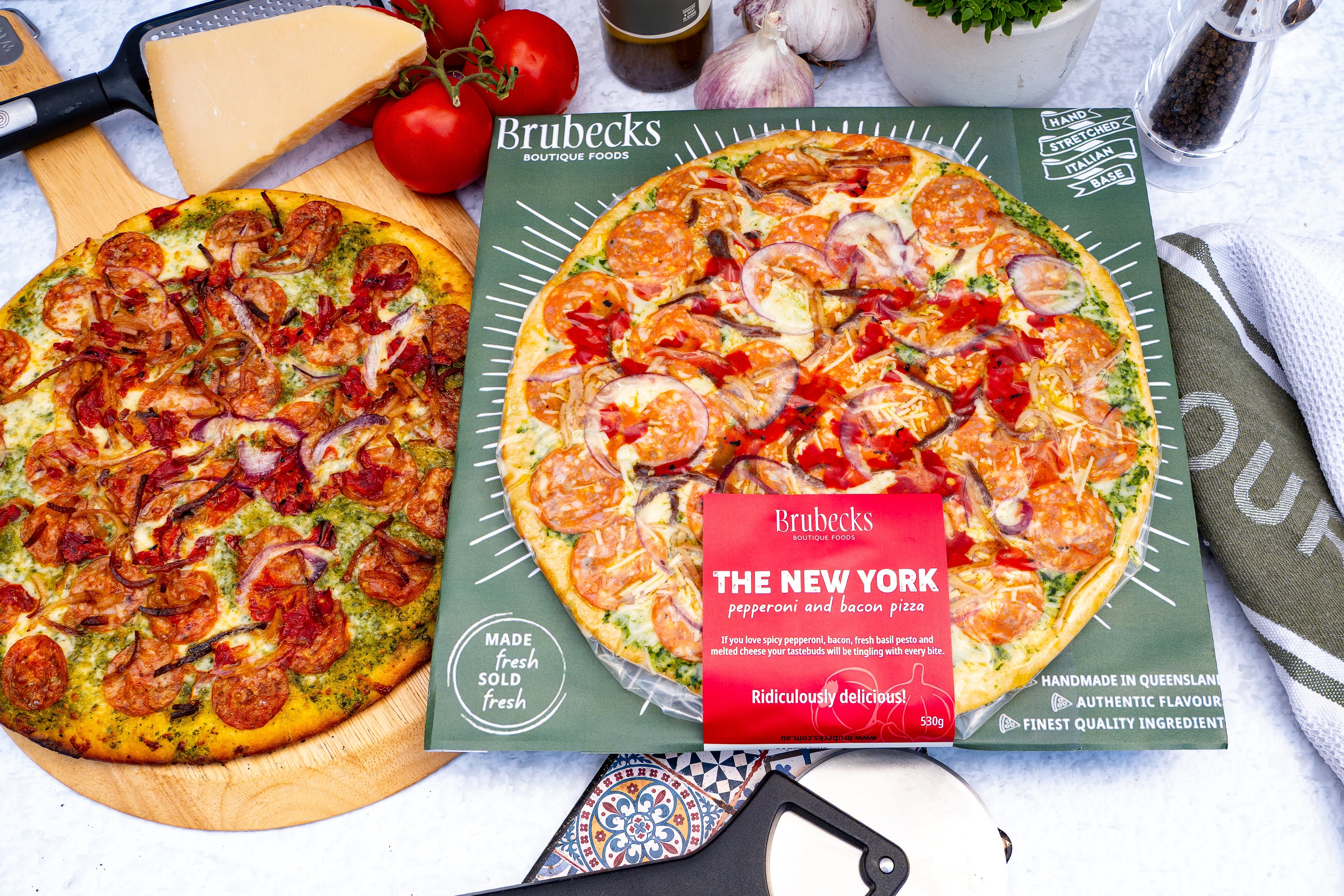 Brubecks pizza packaging with two pizzas on a table