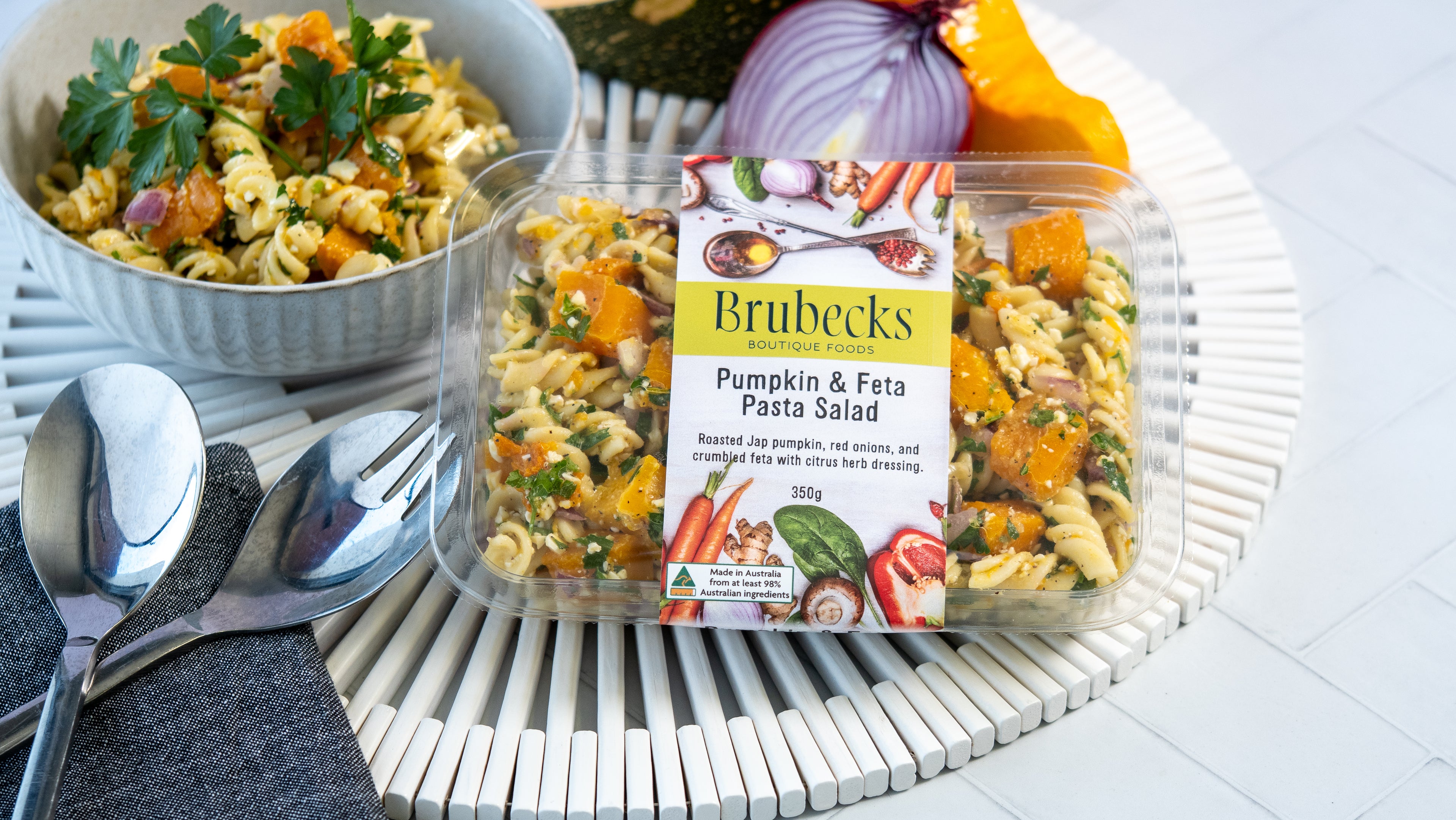 Brutbecks Pumpkin & Feta Pasta Salad packaging on a table with a pasta salad dish.